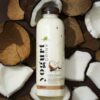 Zayith Coconut Yogurt Drink, 500ml bottle on fresh coconut pieces